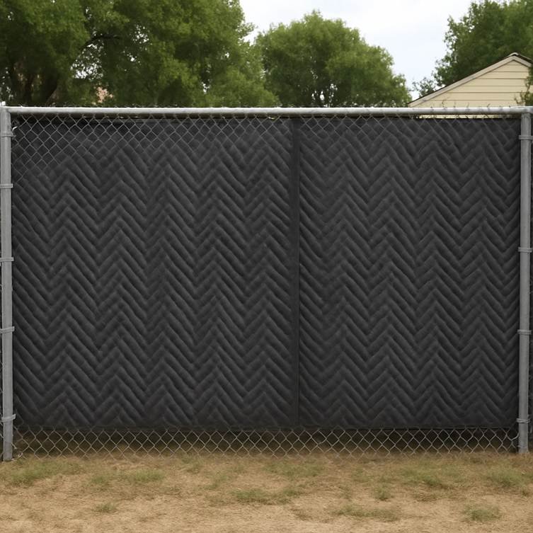 Outdoor pickleball noise barrier installed on chain-link fence using acoustic sound-dampening panels